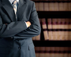 businessman-in-front-of-bookcase